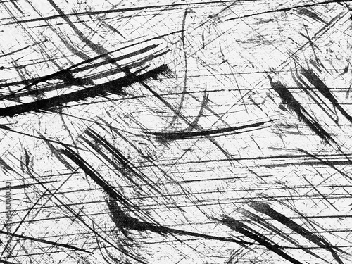Abstract texture with black lines and scratches on a white background showing dynamic movement