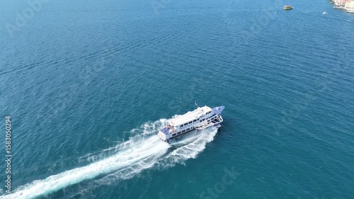 Drone tracking Hydrofoil arriving at Malcesine Lake Garda Italy