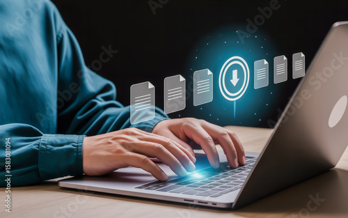 Person typing on laptop with digital files hands