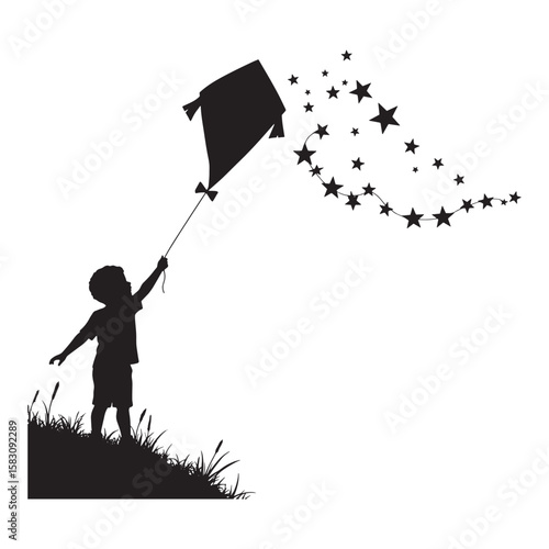 Silhouette of a young boy with a kite releasing stars into the summer sky