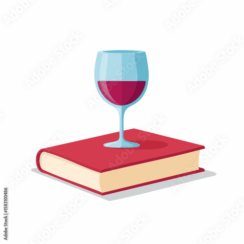 Glass of red wine rests atop a red hardcover book, isolated on white
