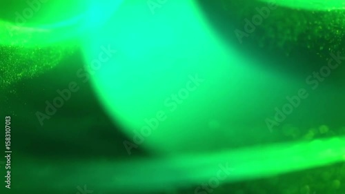 Green Abstract Glow: An abstract image featuring vibrant green hues and glowing lines, perfect for backgrounds or design elements. The image evokes feelings of energy, growth, and nature.