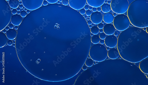 Oil bubbles. Close-up of oil bubbles on water. Abstract texture in dark blue tones. Macro photography