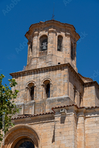 Wallpaper Mural Historic bell tower in Toro, Zamora, showcasing Romanesque architecture against a clear blue sky Torontodigital.ca