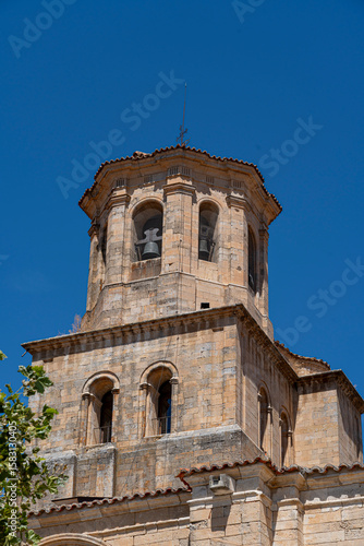 Wallpaper Mural Historic church bell tower in Toro, Zamora showcasing impressive stonework against a clear blue sky Torontodigital.ca