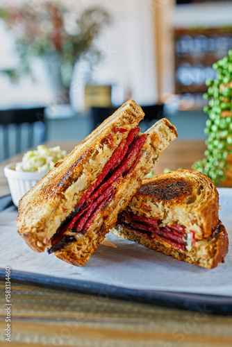 Rueben sandwich made with smoked pastrami, sauerkraut and thousand island dressing