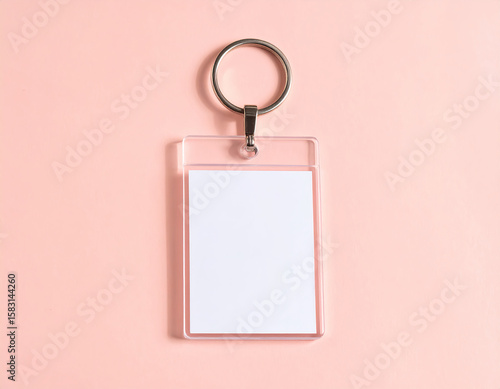 A minimalist acrylic charm pendant on clean pastel background with empty space for text, popular keychain decoration style