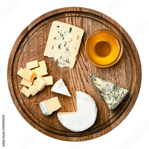 Assorted gourmet cheese platter featuring parmesan cubes blue mold cheese camembert and honey on rustic wooden serving board