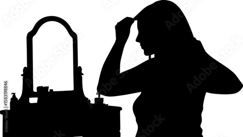 Silhouette of woman styling hair in front of vanity mirror with beauty products in a black and white image