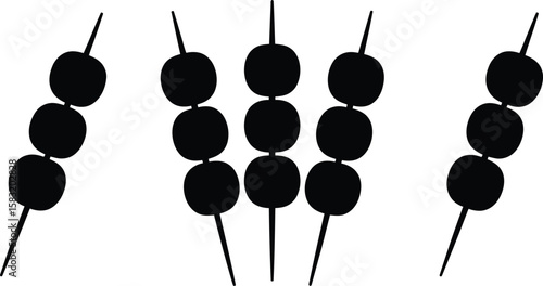 Simple black silhouette of three skewers with round food items on white background