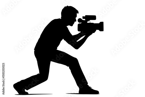 Silhouette of a man filming with a camera in action