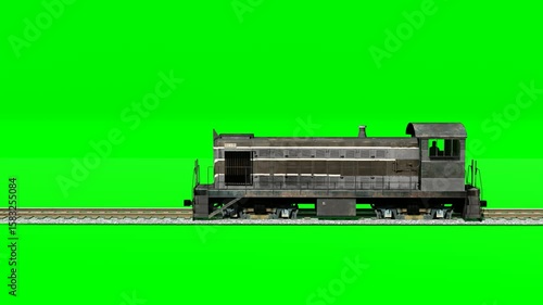 Black cargo train engine moving on chroma green for keying.