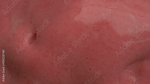 Close-up sequence of creamy pink dessert showcasing texture and gloss, with gradual zoom in highlighting smooth surface and rich color 