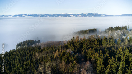 View of the snowy landscape of the Krkonoše Mountains during an inversion