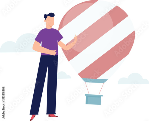 A boy is standing with air balloon.