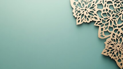 Detailed golden floral lace corner design on a mint green background