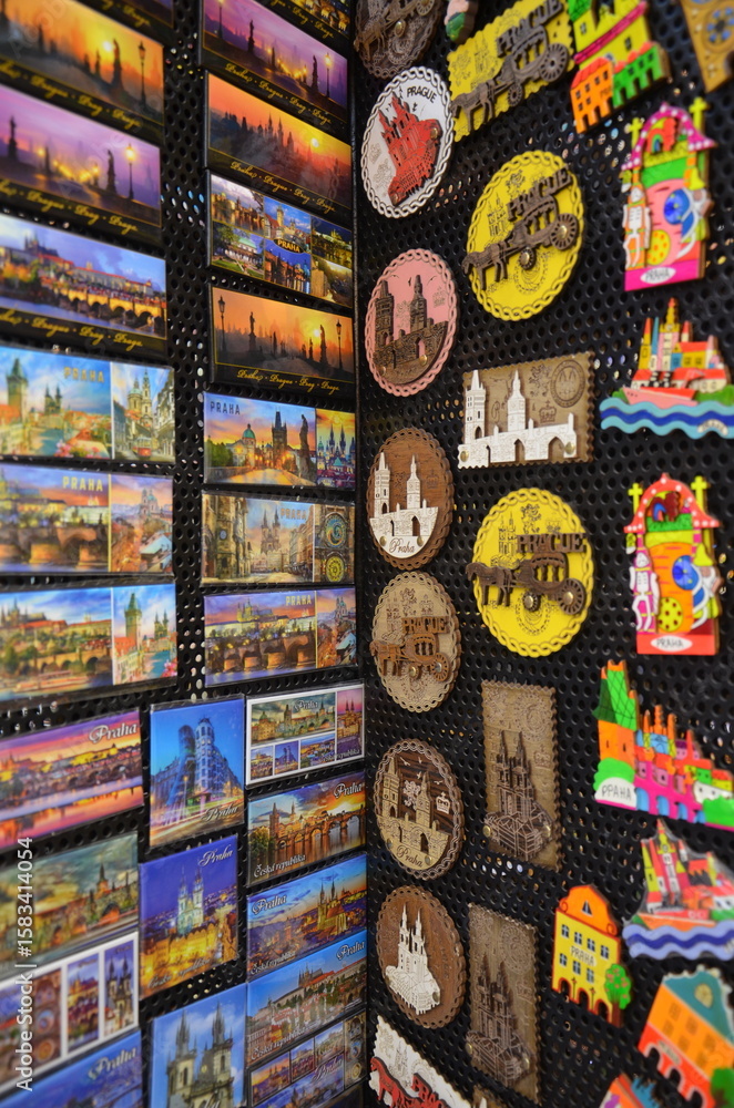 Fototapeta premium A collection of various colorful refrigerator magnets attached to a fridge door, often used as decoration or souvenirs from travels.