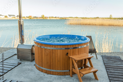 Outdoor hot tub near lake. Jacuzzi bubbles	