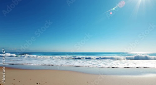 Serene Beach Scene With Gentle Waves Under A Bright Blue Sky And Sunlight