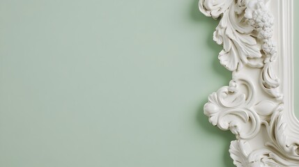 Ornate white frame against a mint green background