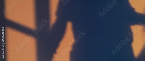 Wallpaper Mural Soft shadow figure silhouette against light orange background Torontodigital.ca