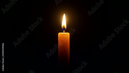 Single lit candle in dark background