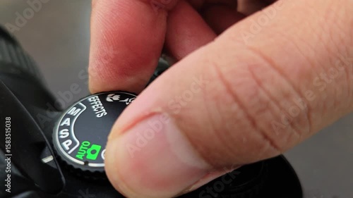 Camera Mode Dial Adjustment Switching from Auto to Manual Settings.