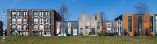 Modern colorful residential buildings along the water in the Vathorst district in Amersfoort.