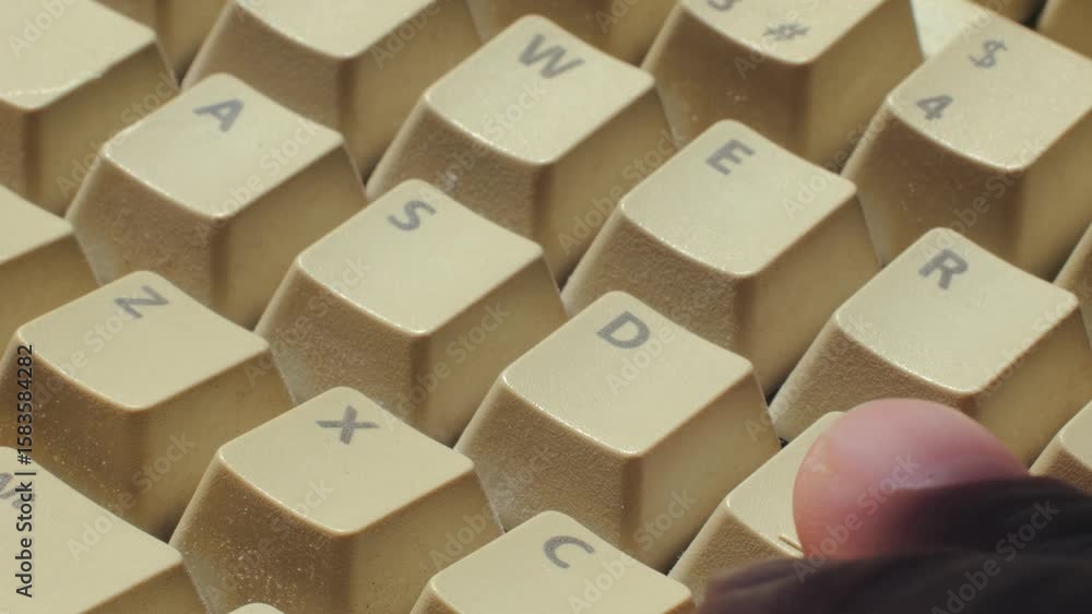 Man working and gaming on retro computer PC, IT engineer with vintage computer at home, using old fashion technology, close up of retro setup. Man working and gaming on retro computer PC, IT engineer with vintage computer at home, using old fashion technology, close up of retro setup.