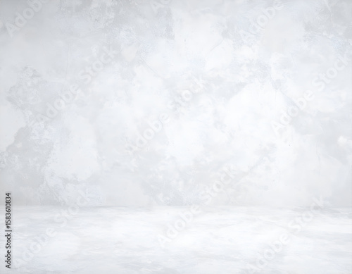 Subtle light gray textured studio background offering a clean and versatile space.