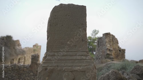 
A stele in an ancient Greek city with inscriptions in ancient Greek. Ancient City in Antalya, Alanya Syedra 