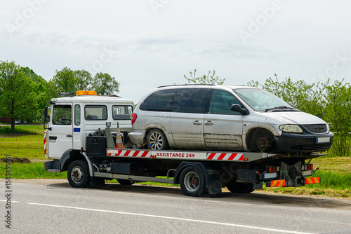 Wallpaper Mural Tow Truck Transporting a Damaged Minivan on a Country Roadside with 24-Hour Assistance Service Torontodigital.ca
