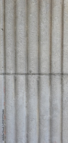 Vertical stone texture with fluted architectural pattern. Ideal for backgrounds, architectural references, 3D modeling, or surface design.