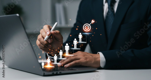 Business man using laptop for target achievement and success