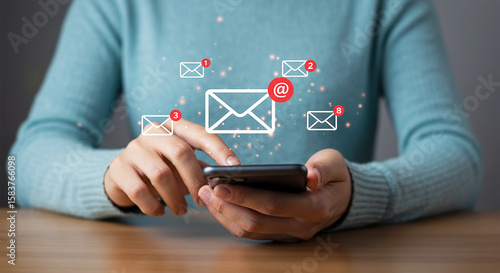 Woman checks email inbox on smartphone, managing digital communications