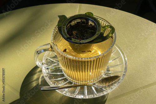 Sunlit Glass Teapot of Herbal Tea for Relaxation