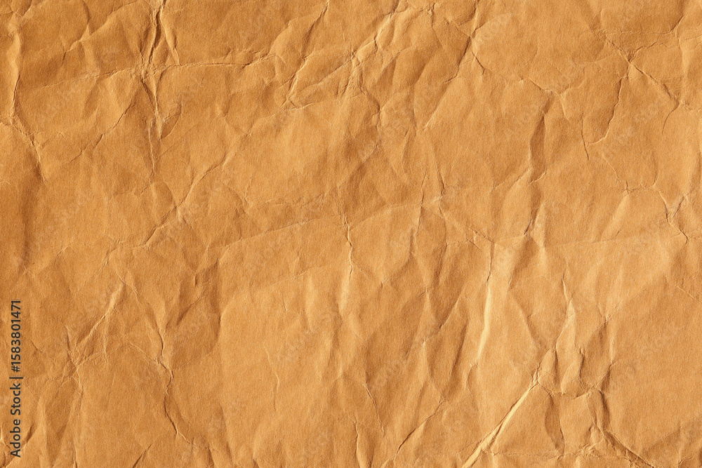 Fototapeta premium Brown creased kraft paper texture