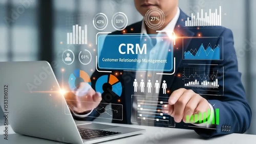 A man is using crm to analyze business data