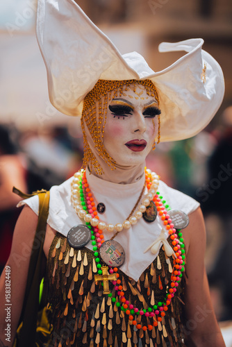Obraz na plátně Paris, France – June 28, 2025: person in extravagant makeup and headdress at pri