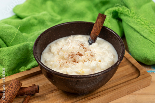 Typical Brazilian sweet dessert, made with Canjica corn. White porridge with cinnamon and coconut and condensed milk. Consumed in June festivities (festa Junina).