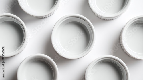 Empty white ramekins arranged