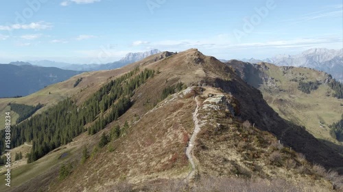 woman hiking along mountain ridge in the Austrian Alps, 4k footage