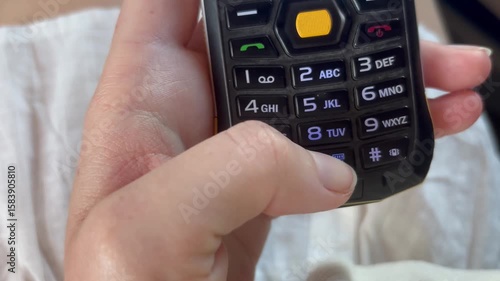 Vintage mobile phone keypad dialing