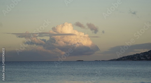 clouds hovering over the sea