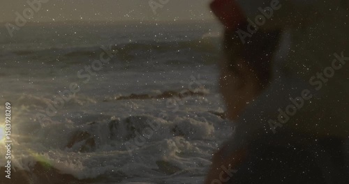 As child climbing onto shoulders, woman holding toddler balancing bucket bonding over travel sunset