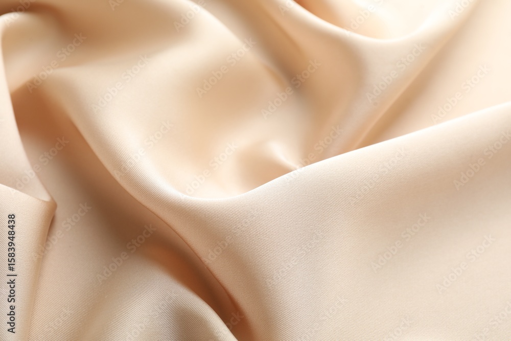 Fototapeta premium Crumpled beige silk fabric as background, above view