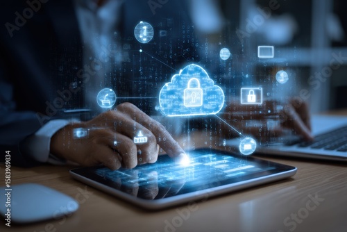 Businessman utilizing a digital tablet and laptop with a padlock on network security technologies, cloud computing, and cybersecurity. Cybersecurity network. Data protection concept