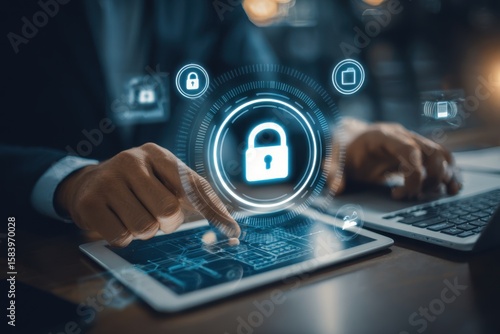 Businessman utilizing a digital tablet and laptop with a padlock on network security technologies, cloud computing, and cybersecurity. Cybersecurity network. Data protection concept