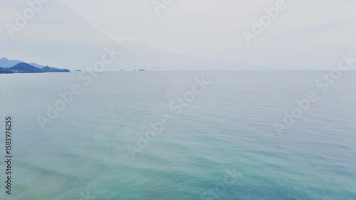 Drone view of amazing white sand beach blending with turquoise waters, palm trees