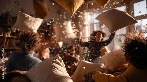 Energetic Pillow Fight Among Friends in Sunlit Living Room Captures Joy and Playfulness